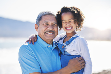 Image showing Happy, beach and portrait of child with grandfather on a vacation as travel together on outdoor holiday for happiness. Hug, smile and grandparent with kid or grandchild by ocean or sea for adventure