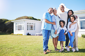 Image showing Happy family, portrait and real estate on garden grass in property, investment or moving in new home together. Parents, grandparents and kids smile in happiness for buying house, building and finance
