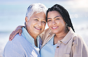 Image showing Portrait, beach, mother and daughter, hug and family with vacation, support and summer break. Face, elderly mama and parent with girl, seaside holiday and embrace with travel, ocean trip and getaway