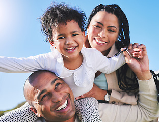 Image showing Parents, piggyback or portrait of child in nature as a happy family on summer holiday vacation together. Smile, mom or dad bonding with an excited kid toddler in park with love, trust or support