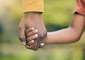 Image showing Park, holding hands and family child, parent and walk in forest, woods and relax journey for love, security and support. Closeup, unity and kid bonding, freedom and together in natural nature garden