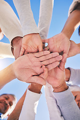 Image showing Stack of hands, blue sky and diversity of people for community in collaboration for global support. Teamwork, palm and low angle of group of friends with positive vision, trust and love outdoors.