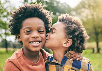 Image showing Portrait, kids and boy siblings kiss in a park for play, fun and bonding in nature together. Family, face and brothers hug, African children and happy outdoor with love, support and trust on weekend
