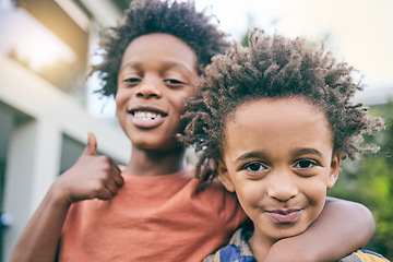 Image showing Kids, portrait and hug with thumbs up in a backyard for brothers, bonding and fun outdoor. Black family, love and face of children in a garden embrace with hand emoji, gesture or yes sign on weekend