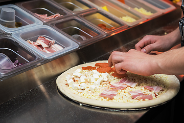 Image showing making pizza at kitchen of pizzeria