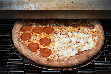 Image showing Preparing pizza in oven