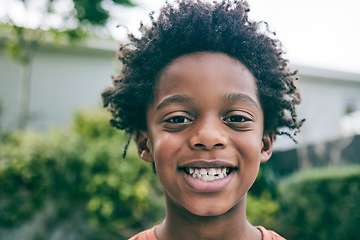 Image showing Portrait, kid and face of boy outdoor in garden, park and backyard of home for fun, good mood and smile. Happy, confident and african child relax in neighborhood for freedom, joy and play in Nigeria