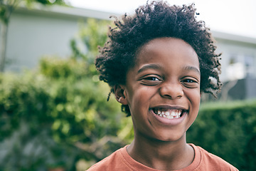 Image showing Happy portrait, child and boy outdoor in garden, park and backyard of home for fun, good mood and play. Face, smile and confident young african kid relaxing in summer, nature and freedom in Nigeria