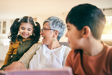 Image showing Happy kids, smile or grandma reading a book for learning, education or storytelling on sofa at home. Family, senior or grandmother with children siblings for a fantasy story to enjoy bonding together