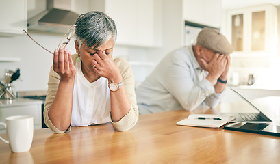 Image showing Frustrated senior couple, headache and fight in divorce, debt or financial crisis together at home. Unhappy mature man and woman in stress, anxiety or depression in finance struggle, fail or mistake