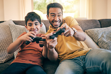 Image showing Family, fun and a boy gaming with his father on a sofa in the living room of their home together for competition. Video game, children and a man learning how to play from his gamer son in the house