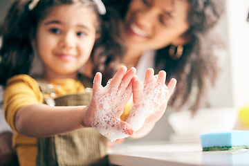 Image showing Soap, cleaning hands and family with child in bathroom for learning healthy hygiene routine at home. Closeup, mom and girl kid washing palm with foam for safety of bacteria, dirt or germs on skincare
