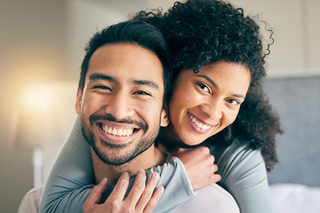 Image showing Couple, portrait and hug in bedroom, smile and love with bonding, care and trust in healthy relationship. Interracial, people relax at home and happy, romance and partner with marriage and commitment