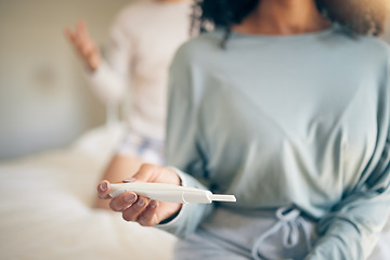 Image showing Hands, woman and bed with pregnancy test, closeup and home for results, planning or news to start family. Girl, exam and notification in bedroom, apartment and anxiety for maternity, future or baby