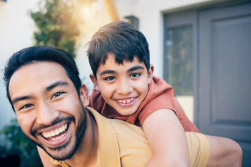 Image showing Face, smile and father piggyback child by home, bonding and excited together. Portrait, kid and dad carrying boy, funny laugh and happy with care, play and support for healthy connection of family