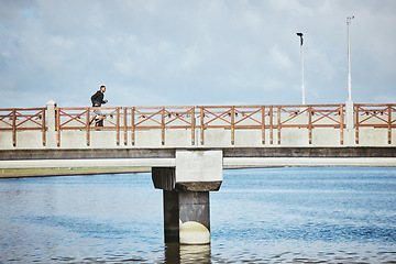 Image showing Exercise, sky and a man running on a bridge for a cardio or endurance workout on cloud mockup space. Fitness, sports and training for a marathon with a male runner or athlete outdoor for a challenge