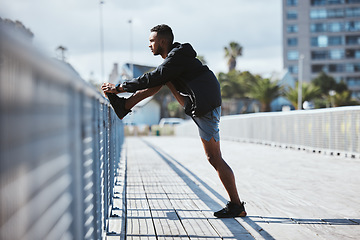 Image showing Workout, outdoor and man stretching, fitness or training with warm up, bridge and exercise with health. Athlete, person or runner in a city, stretch and wellness with practice, body or morning cardio