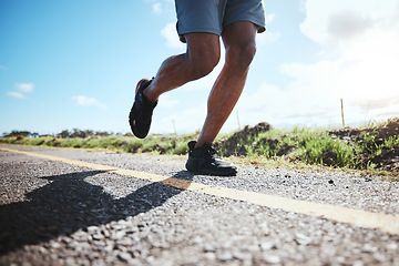 Image showing Legs, workout and runner in road, fitness and exercise in nature for marathon, wellness and cardio with shoes. Sport, person in street and outdoors running for speed achievement, race and training