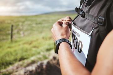 Image showing Hands, marathon and bib of man outdoor for running exercise, training and healthy body. Sport, race and competition number of athlete in cardio, fitness workout and wellness in countryside nature