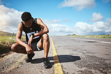 Image showing Tired, runner or man with fitness, sports or exhausted with workout, challenge and training. Person, marathon or athlete outdoor, exercise or fatigue with rest, breathing or break with intense cardio