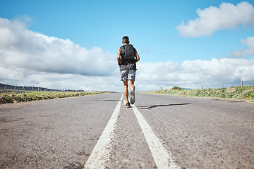 Image showing Back, marathon runner and man on road outdoor, cardio and healthy body. Athlete, training and fitness exercise in competition, workout sport or race on street in wellness at countryside mockup space