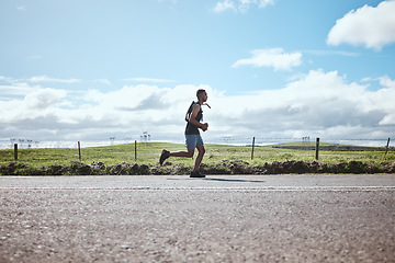 Image showing Training, marathon runner and man on road outdoor, cardio or healthy body. Athlete, sport and fitness exercise in competition, workout energy or race on street in wellness at countryside mockup space