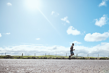 Image showing Marathon runner, fitness and man on road outdoor, cardio or healthy body. Athlete training, sport and exercise in competition, workout energy or race on street in wellness at countryside mockup space