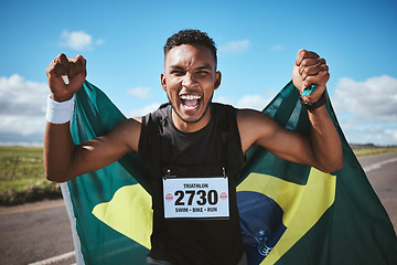 Image showing Portrait, sports and flag of Brazil with a man runner on a street in nature for motivation or success. Fitness, winner and celebration with an athlete cheering during a cardio or endurance workout