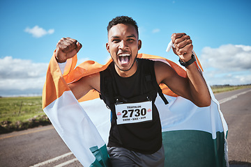 Image showing Portrait, fitness and flag of India with a man runner on a street in nature for motivation or success. Sports, winner and health with a male athlete cheering during cardio or endurance training