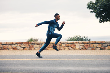 Image showing Runner man, sprint and outdoor in street, nature and profile for speed, fitness and exercise. Athlete guy, fast running and vision on road for workout, training and sports for health in countryside