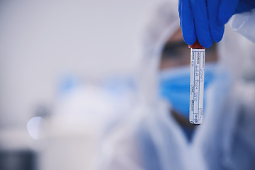 Image showing Hand, science and mockup with a blood sample in a laboratory or innovation or dna research. Healthcare, medical and space for breakthrough in a lab with a doctor holding a glass vial closeup