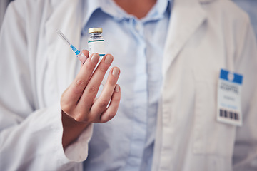 Image showing Doctor, hands and vaccine bottle with injection for medicine, safety and healthcare risk in clinic. Closeup, medical worker and vial with syringe for sick immunity, antivirus and pharmaceutical drugs