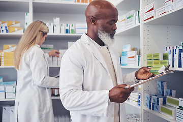 Image showing Pharmacy product, clipboard and mature black man reading medicine label, prescription information or search shop shelf. Hospital inventory, box and African healthcare expert check stock checklist