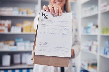 Image showing Woman, pharmacist and hand with paper bag for prescription, note or doctor certificate at pharmacy. Closeup of female person or medical professional giving medication or pharmaceutical at drugstore