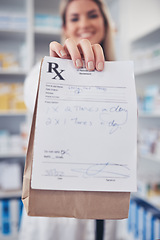 Image showing Pharmacy, hand and prescription medicine with paper in a bag for healthcare, drugs and pharmaceutical. Closeup of a pharmacist or medical worker with rx information, drugstore and retail service