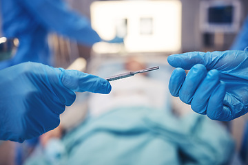 Image showing Hands, scalpel for surgery and collaboration in a hospital during an operation or emergency medical procedure. Teamwork, healthcare equipment and doctors in theatre together to save a patient closeup