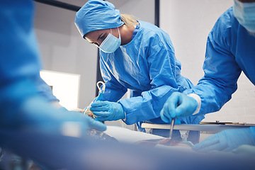Image showing Woman, medical group or surgery operation, hospital support and doctors healing wound, injury or patient anatomy. Cancer treatment, ICU team or closeup surgeon collaboration in operating room theater
