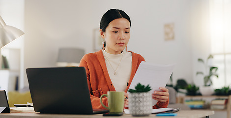 Image showing Remote work, paperwork and Asian businesswoman working on laptop from home, house or apartment. Freelance, worker and professional employee review report and planning company strategy on documents