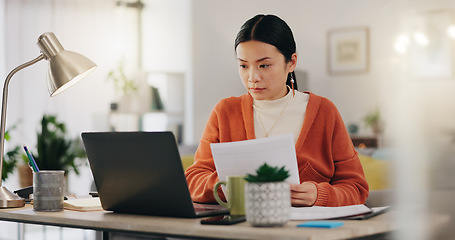 Image showing Remote work, paperwork and Asian businesswoman working on laptop from home, house or apartment. Freelance, worker and professional employee review report and planning company strategy on documents