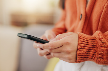 Image showing Relax, text message and phone with hands of woman on sofa for search, social media and connection. App, technology and digital with female in living room at home for contact, post and browsing