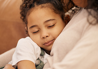 Image showing Sleeping, love and face of a girl with her mother closeup in the living room of their home together for support. Family, hug and daughter in the arms of a parent on a sofa for trust, care or security