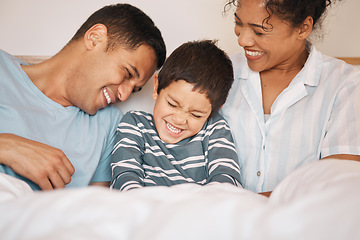 Image showing Happy, tickle and funny with family in bedroom for playful, morning and love. Care, support and wake up with parents and boy child laughing in bed at home for weekend, positive and relax together