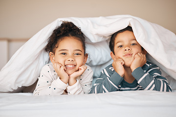 Image showing Siblings, morning and portrait of children in bed in blanket for bonding, love and fun at home. Family, childhood and face of happy young boy and girl in bedroom for relax, resting and smile together