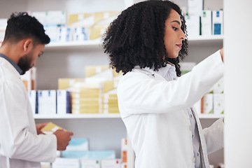 Image showing Healthcare team, pharmacy and medicine on shelf for pills, tablets or medication inspection or inventory. Pharmacist woman or medical staff check stock or pharmaceutical product at drugstore or work