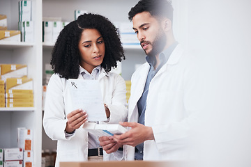 Image showing Healthcare, medicine and a pharmacist team with a box of prescription or chronic medication in a drugstore. Medical, pharmaceutical product and a medicine professional in a pharmacy with a colleague
