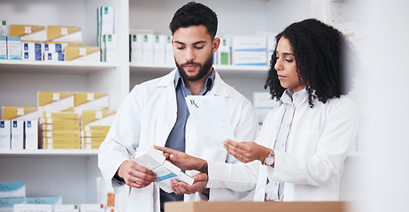 Image showing Healthcare, medicine and a pharmacy team with a box of prescription or chronic medication in a drugstore. Medical, pharmaceutical product and a pharmacist in a clinic with a colleague for health