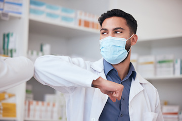 Image showing Man, elbow greeting and pharmacist with healthcare, social distancing or covid regulations. Person, medical professional or employee with protection, mask or greet with pandemic policy in a workplace