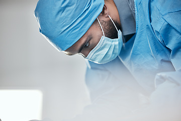 Image showing Healthcare, face mask and a doctor in a theater for surgery, medical consulting or a solution. Serious, thinking and a man or male surgeon working on an emergency cardiology check or inspection