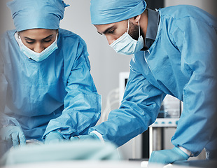 Image showing Doctors, surgery and hospital team in emergency, safety and helping patient. Man, woman and healthcare collaboration of medical surgeon, nurse and operation theater for support in ppe, mask or clinic