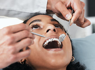 Image showing Mouth, face of woman and dentist with tools for dental, healthcare, assessment and test in clinic. Oral wellness, orthodontics and patient with medical doctor, mirror and excavator for teeth cleaning